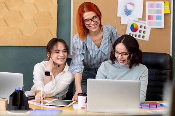 medium-shot-smiley-women-office-1.jpg