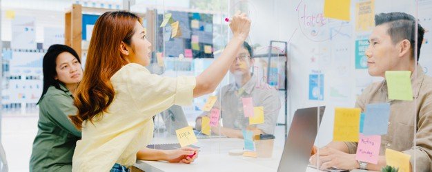 asia-businesspeople-discussing-business-brainstorm-meeting-together-share-data-write-acrylic-partition-stand-back-new-normal-office-lifestyle-social-distancing-work-after-coronavirus_7861-2568-1.jpg