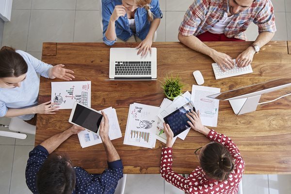 top-view-coworkers-team-working-office-1.jpg